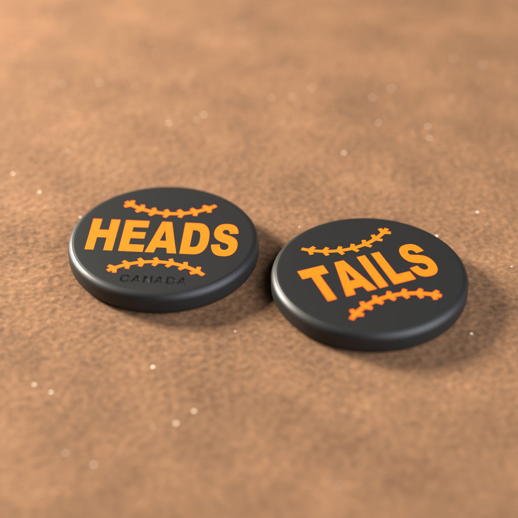 Black umpire flip coin with orange lettering