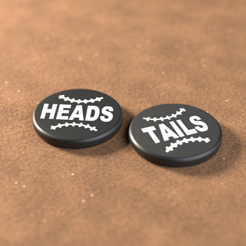 Black umpire flip coin with white lettering