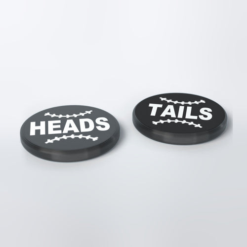 Black umpire flip coin with white lettering