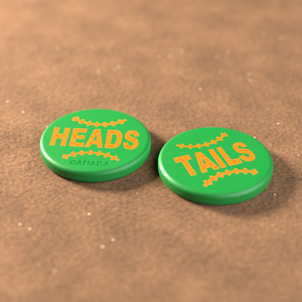 Green umpire flip coin with orange lettering