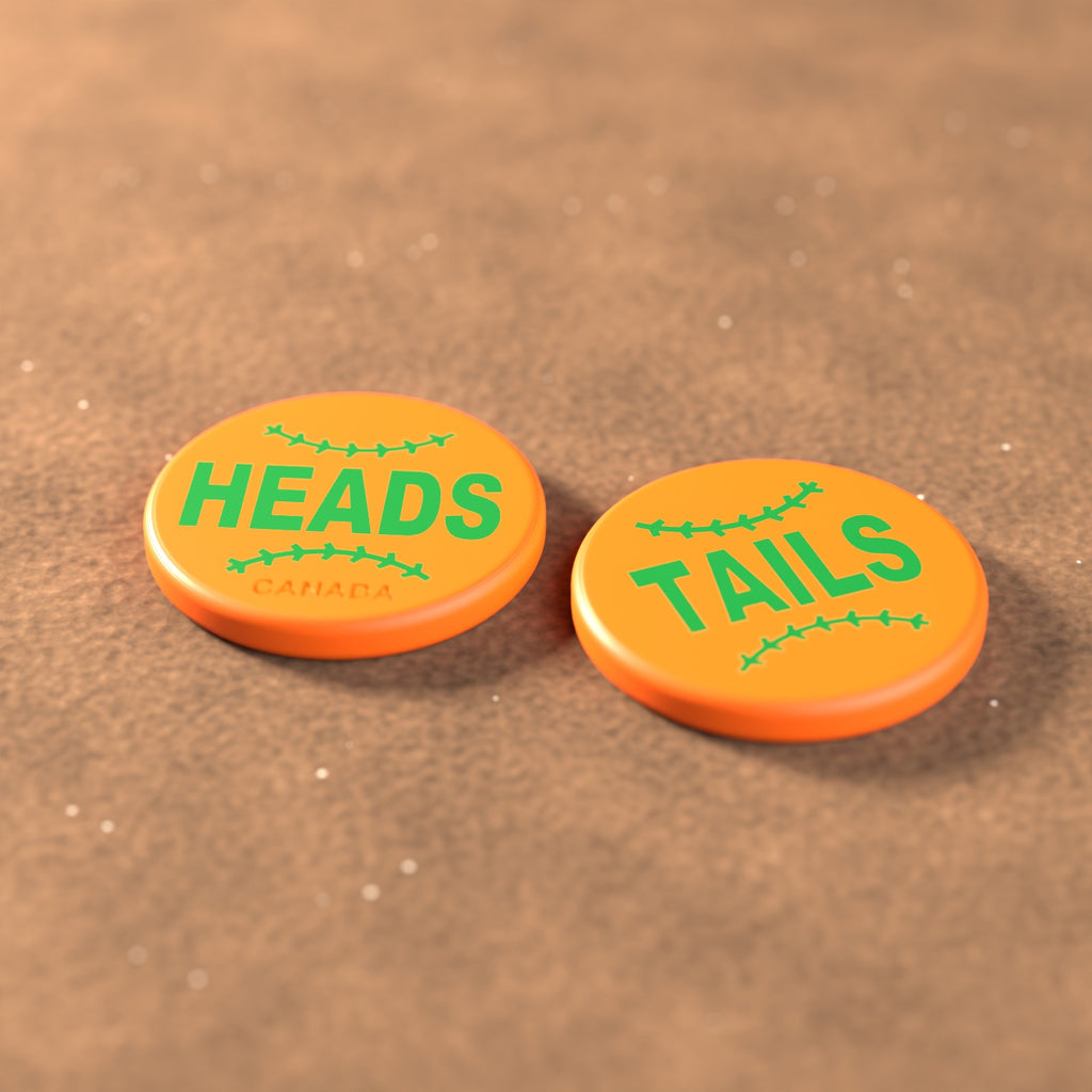 Orange umpire flip coin with green lettering