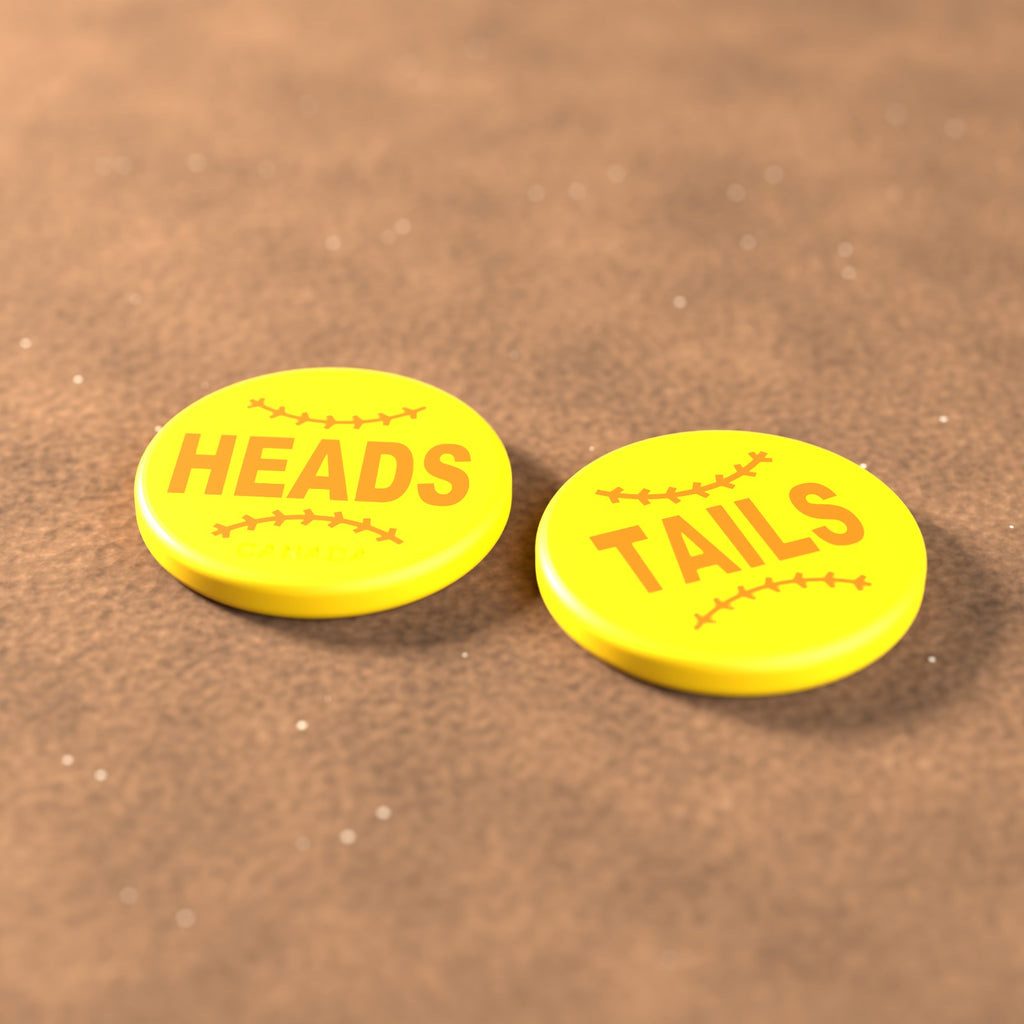 Yellow umpire flip coin with orange lettering